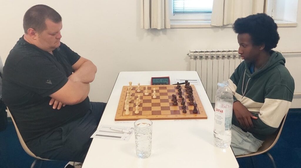 FM Saad Elmi (right) deciding on his third move against GM Ante Saric. Photo courtesy of Aleksander Delchev
